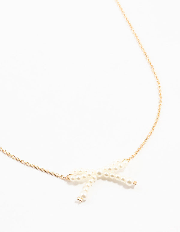 Gold Pearl Bow Necklace